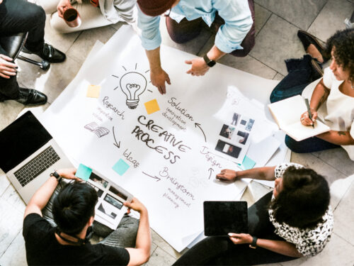 Creative Brainstorm Session on the Floor of a Design Studio